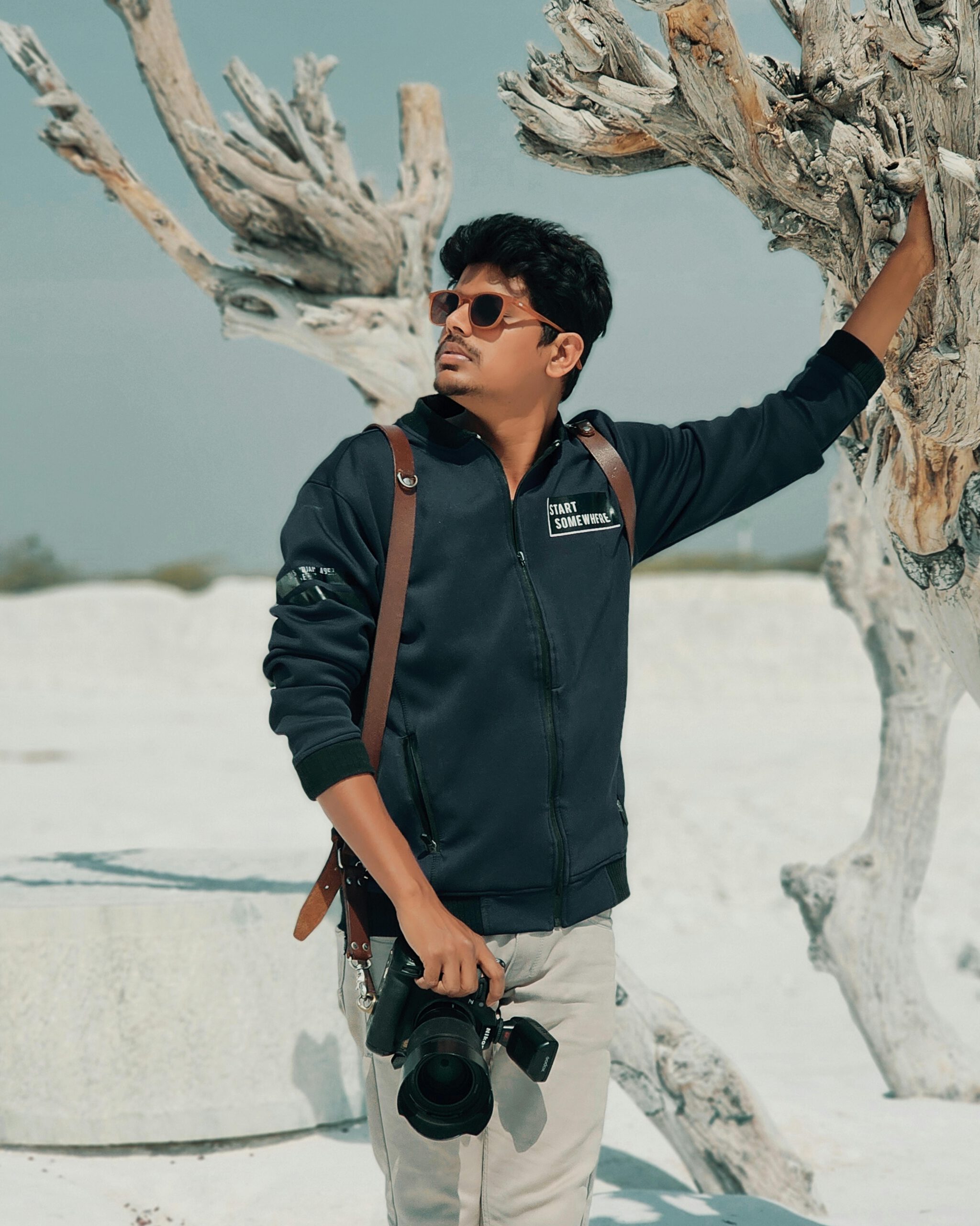 Portrait of a stylish man with a camera in Jaipur, India.